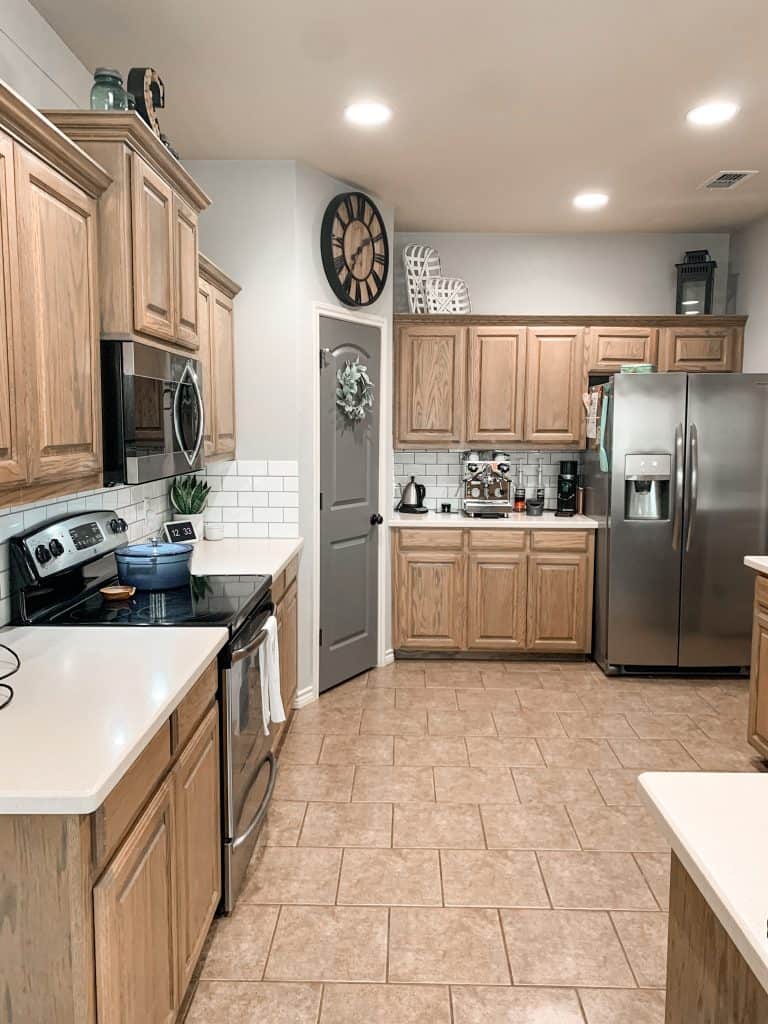 grey kitchen with oak cabinets