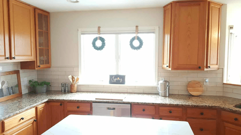 Oak cabinets with silver hardware, similar in color to my bathroom I  think this will work.