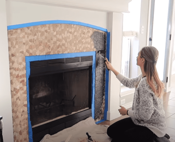 Painting stone fireplace ideas. Painting the stone black. 