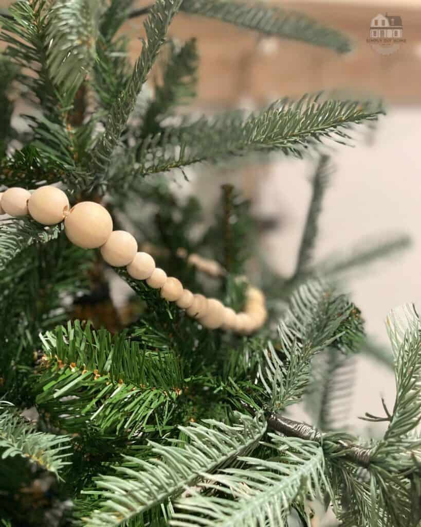 Wood bead garland on tree.