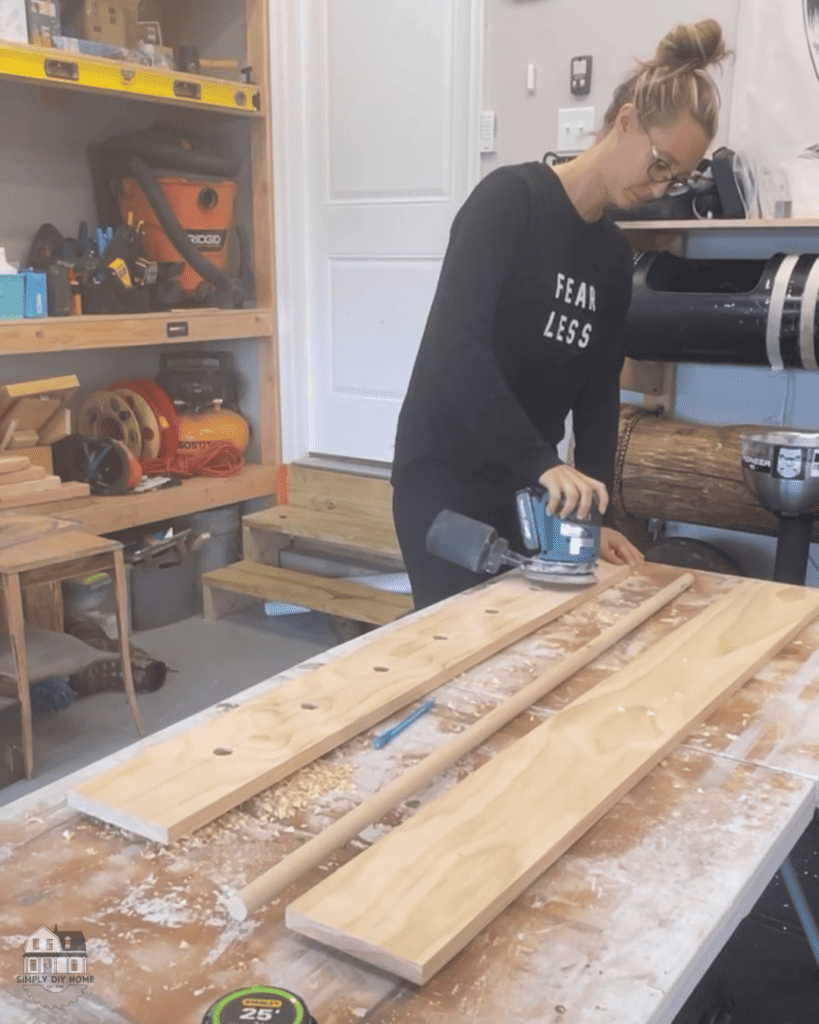 Sanding wood shelf. 